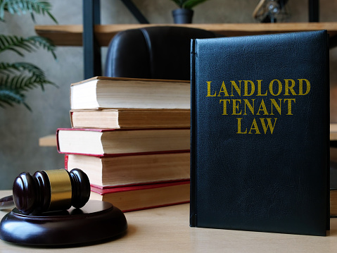Landlord tenant law book on the lawyer table.